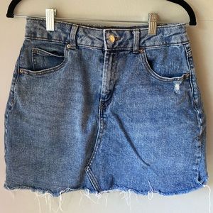 Distressed denim mini skirt